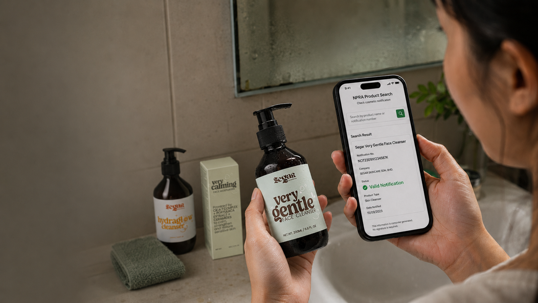 A person in a bathroom holds a smartphone showing a NPRA product app screen while holding a dark amber bottle labeled 'very gentle' by SEGAR. Other SEGAR products and a sponge sit on the bathroom counter in the background.