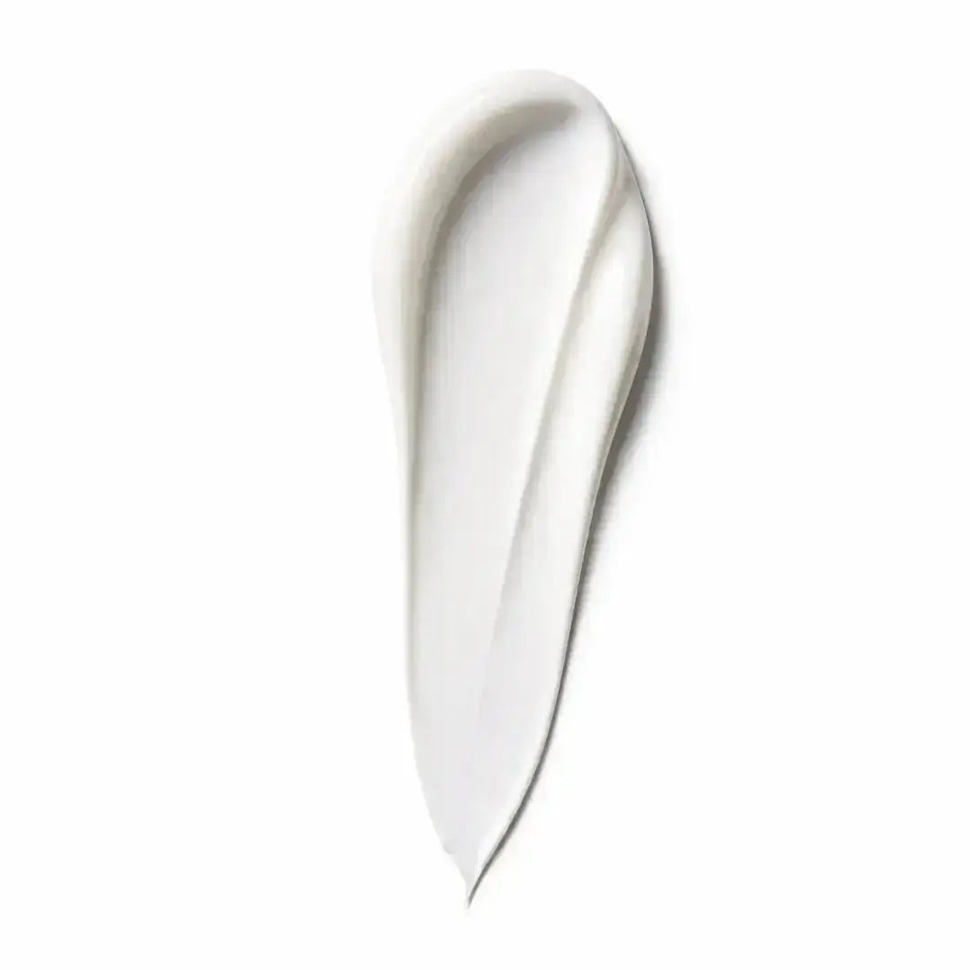 Close-up of white skincare cream texture swatch on a white background