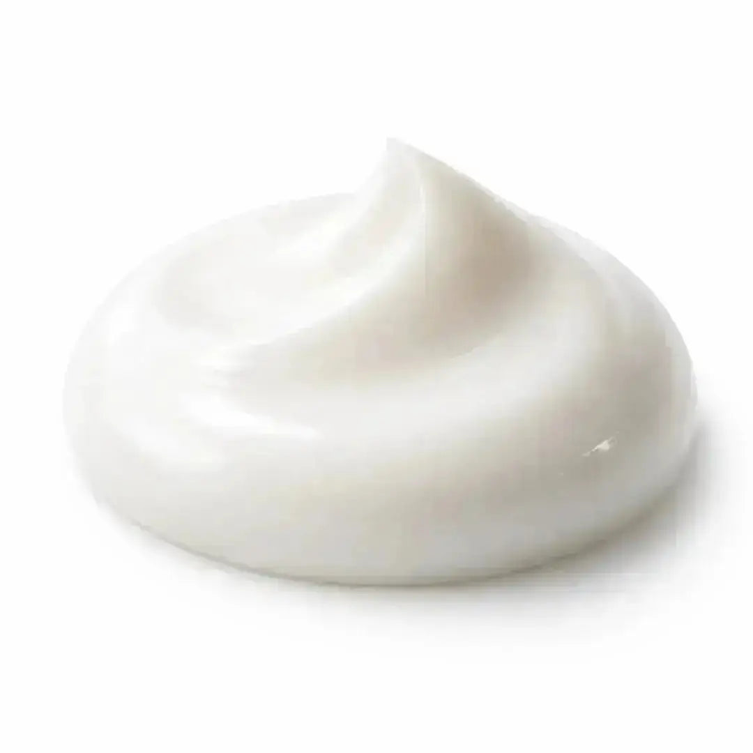 Close-up of creamy white skincare moisturizer for sensitive, dry skin on white background