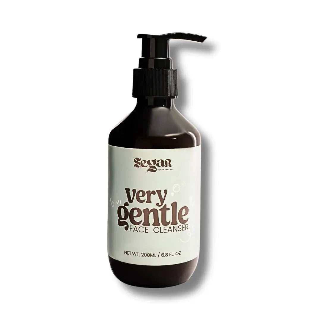 Bottle of 'very gentle face cleanser' with pump on a white background