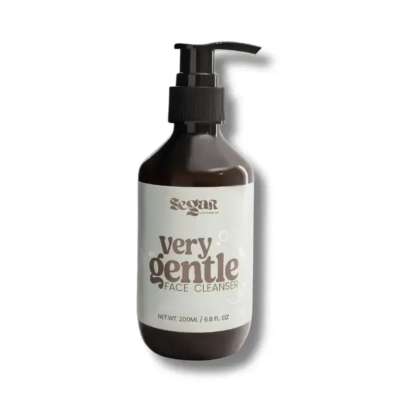 Bottle of very gentle face cleanser with pump on a white background