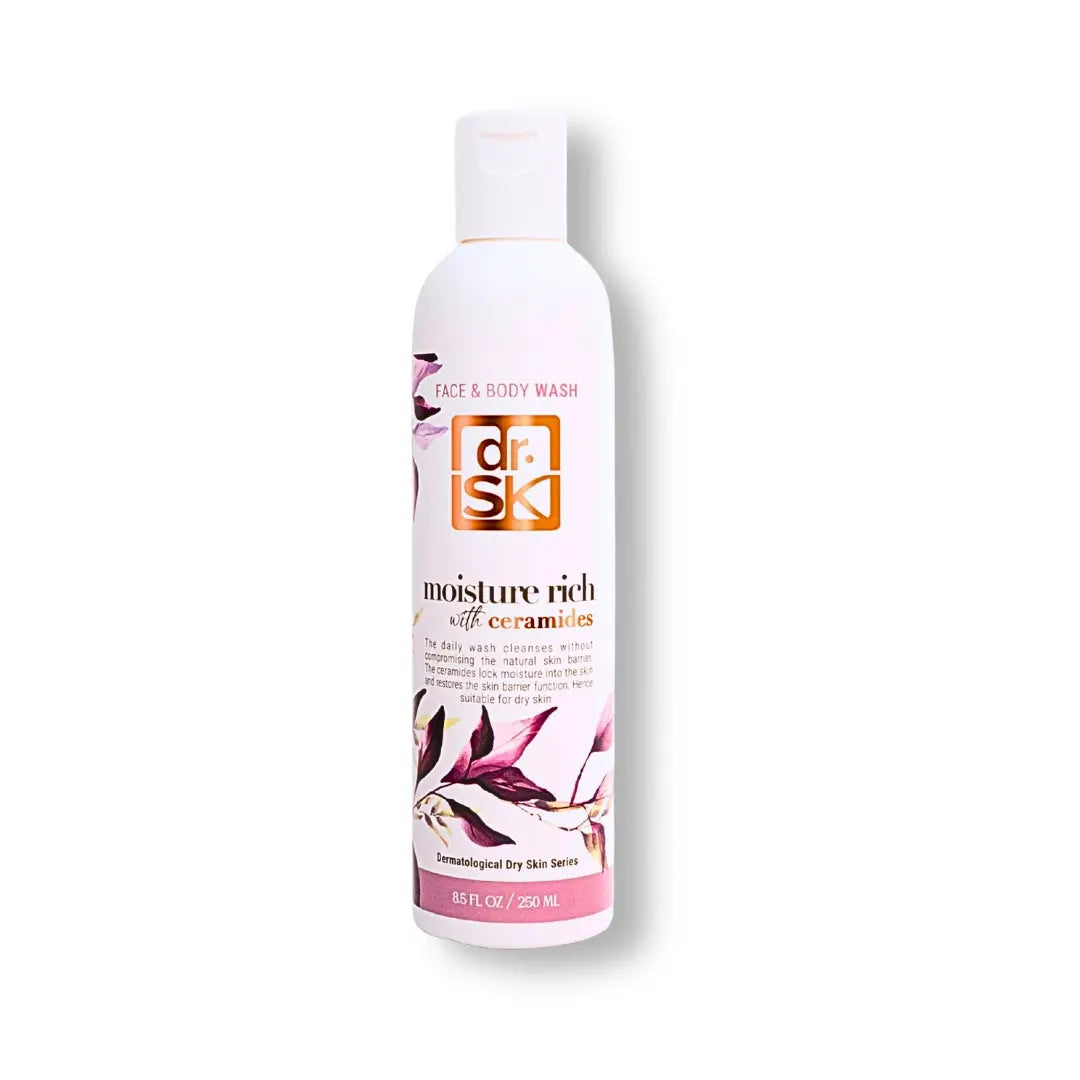 Face and body wash bottle with floral design on a white background