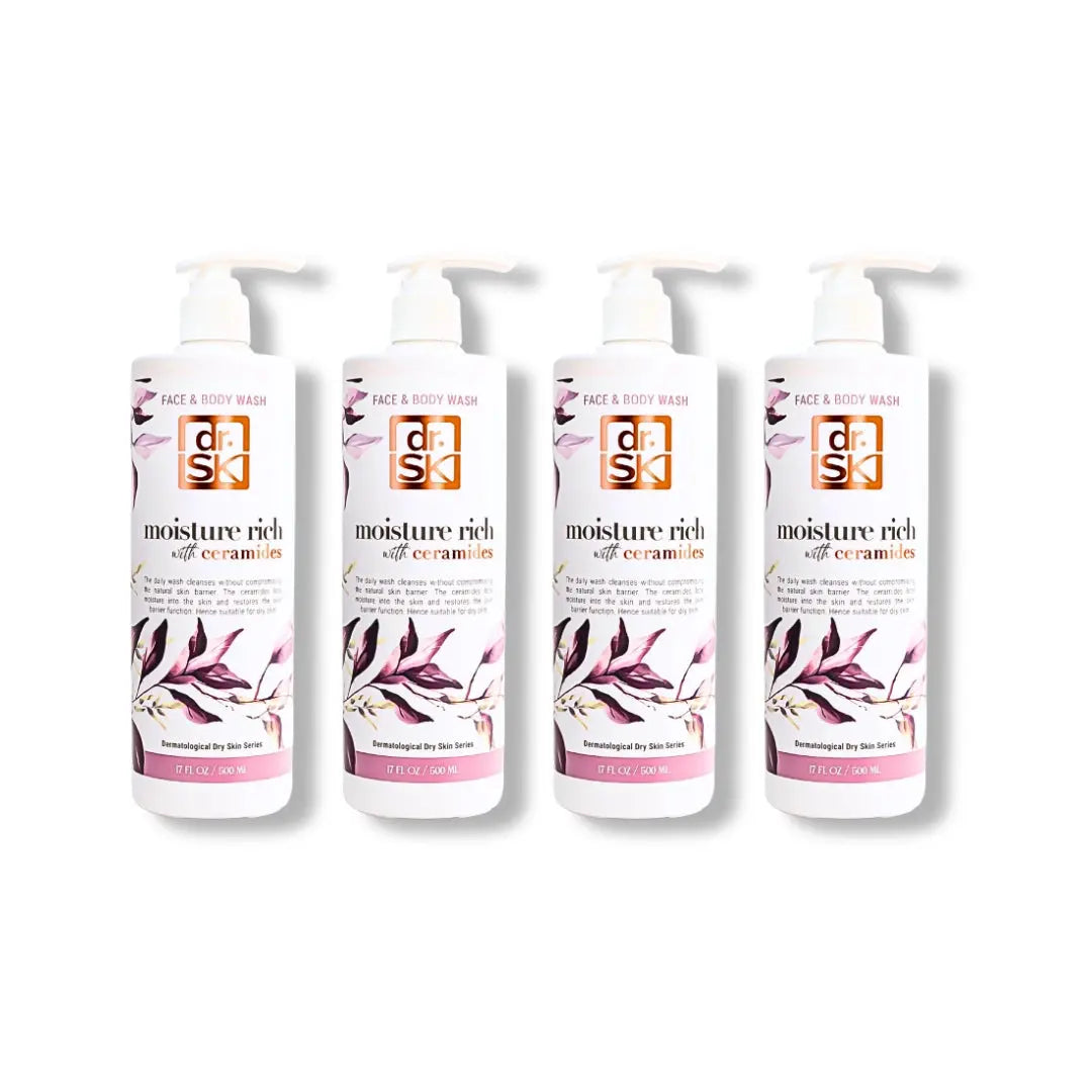 Four bottles of dr.SK face & body wash skincare product with floral design on a white background