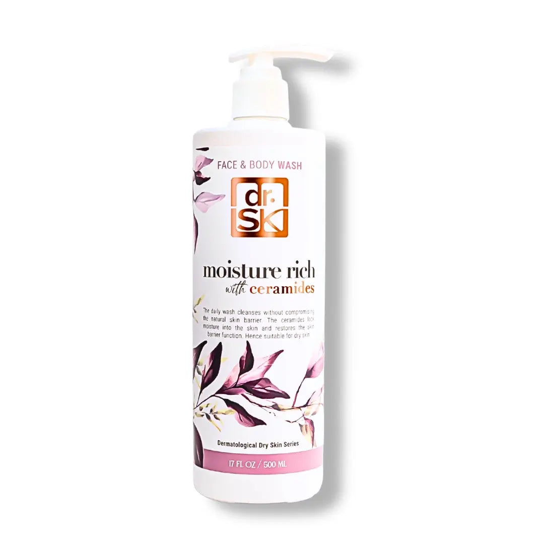Face and body wash bottle with floral design on a white background