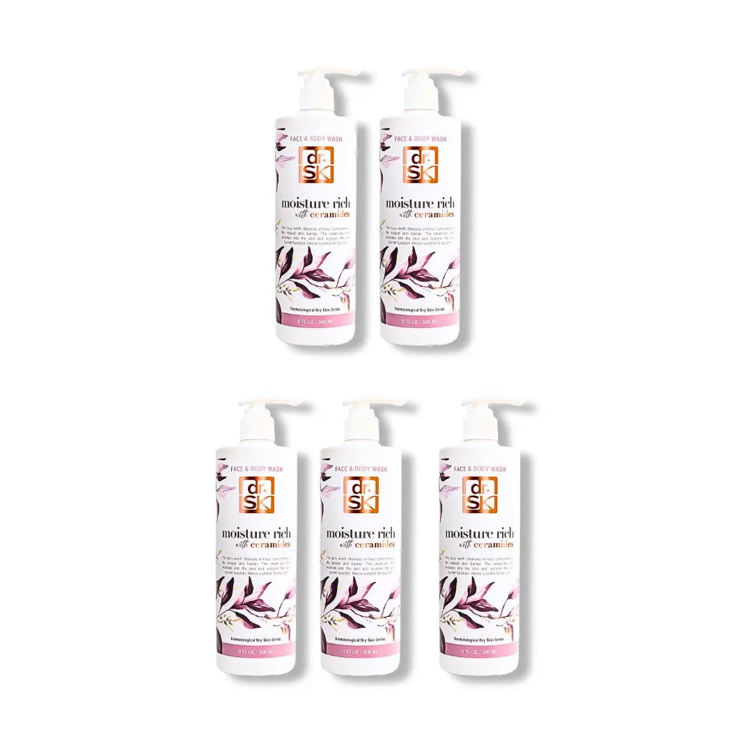Four bottles of dr.SK face & body wash skincare product with floral design on a white background