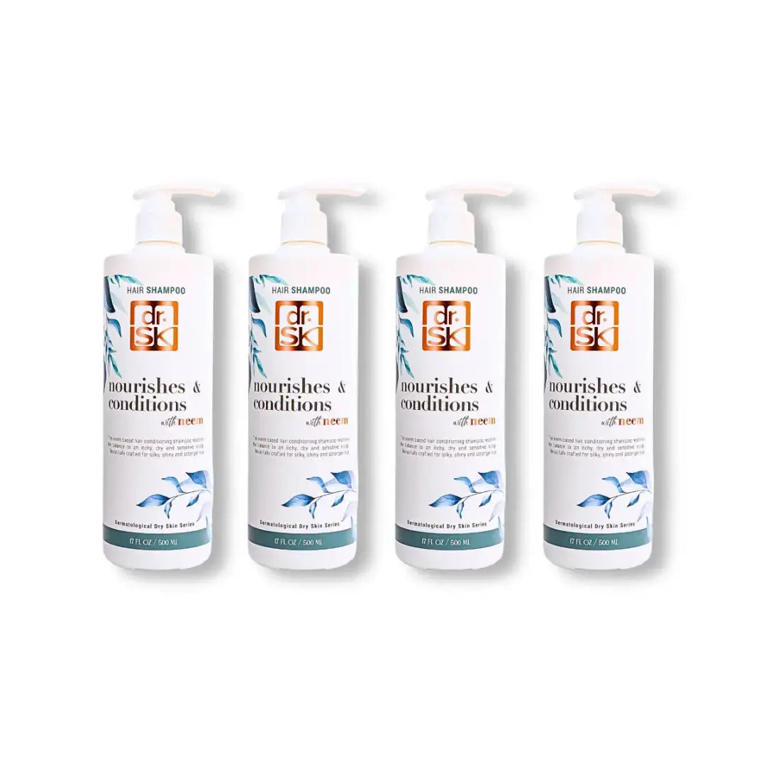 Four bottles of dr.SK Neem hair shampoo on a white background